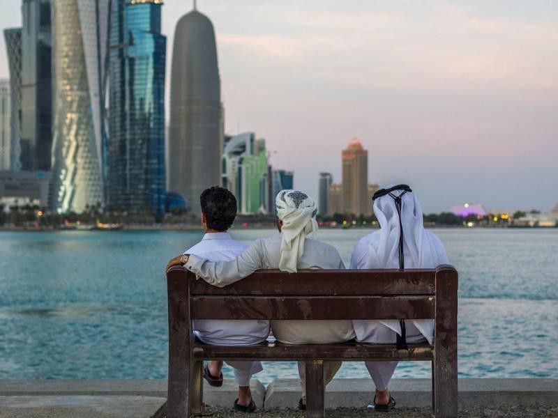 Friends on bench in Qatar