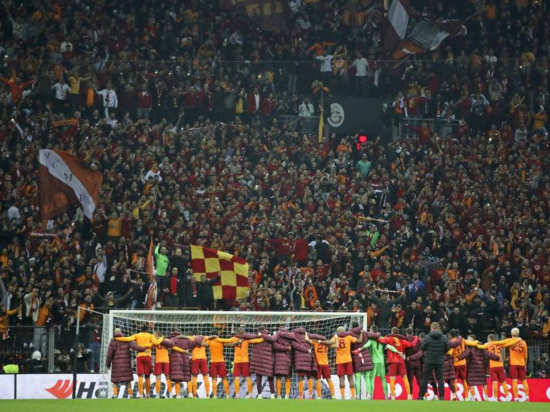 Galatasaray players and fans at Nef Stadium