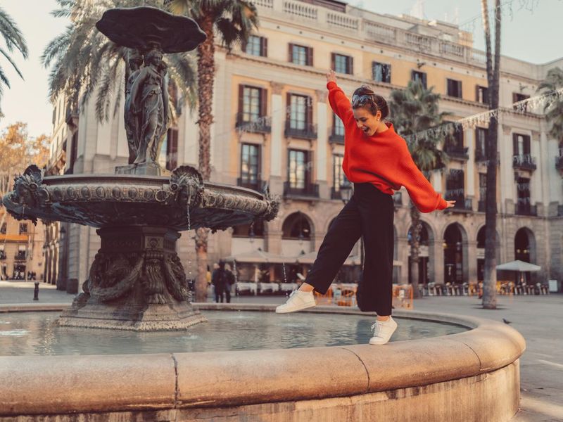 Girl in Barcelona fountain