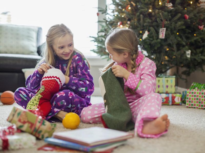 Girls opening Christmas stockings