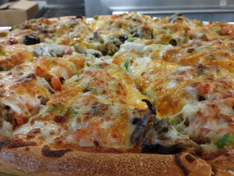 Godfather's Pizza with vegetables and cheese