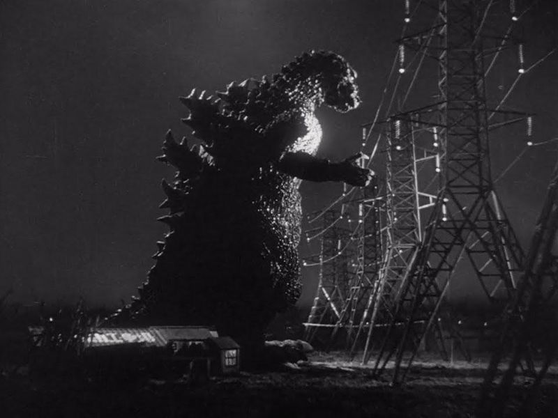 Godzilla destroying electric towers