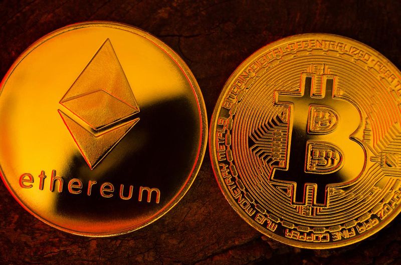 Gold coins of Ethereum and Bitcoin