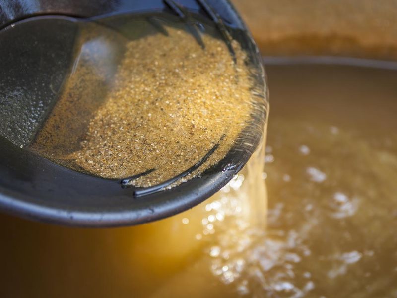 Gold panning pan sifting sand