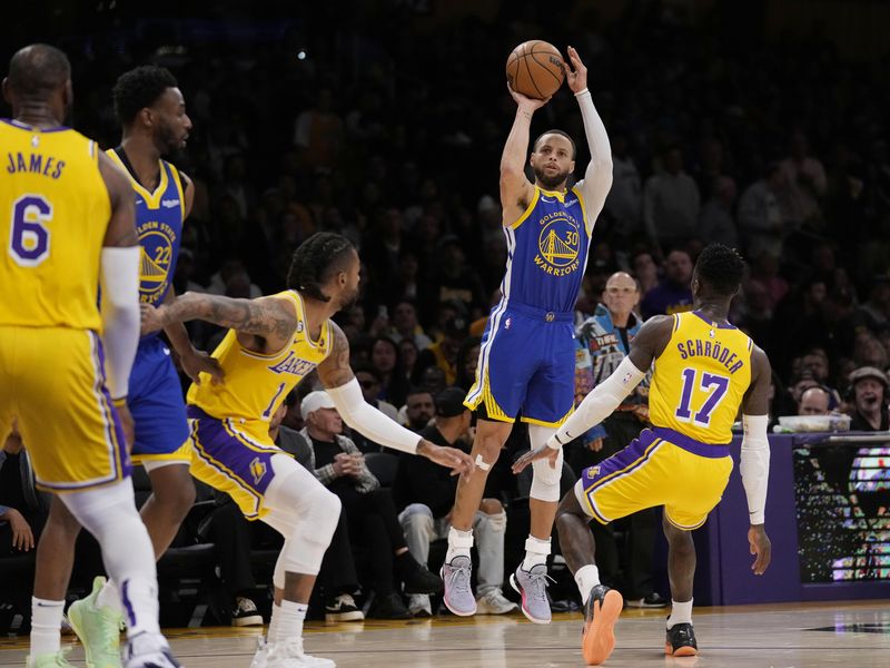 Golden State Warriors guard Stephen Curry shoots against Los Angeles Lakers