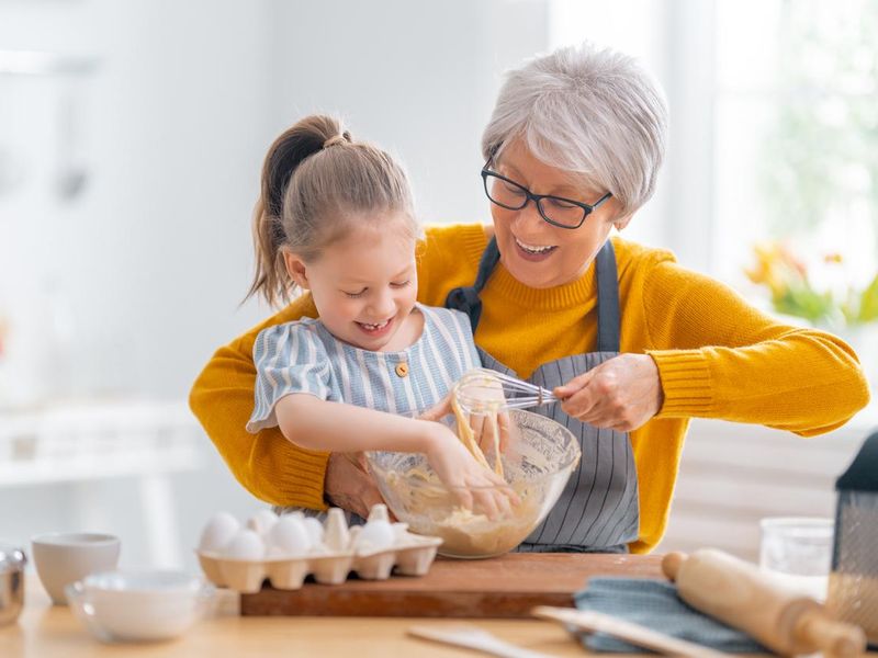 Grandma and her granddaughter baking