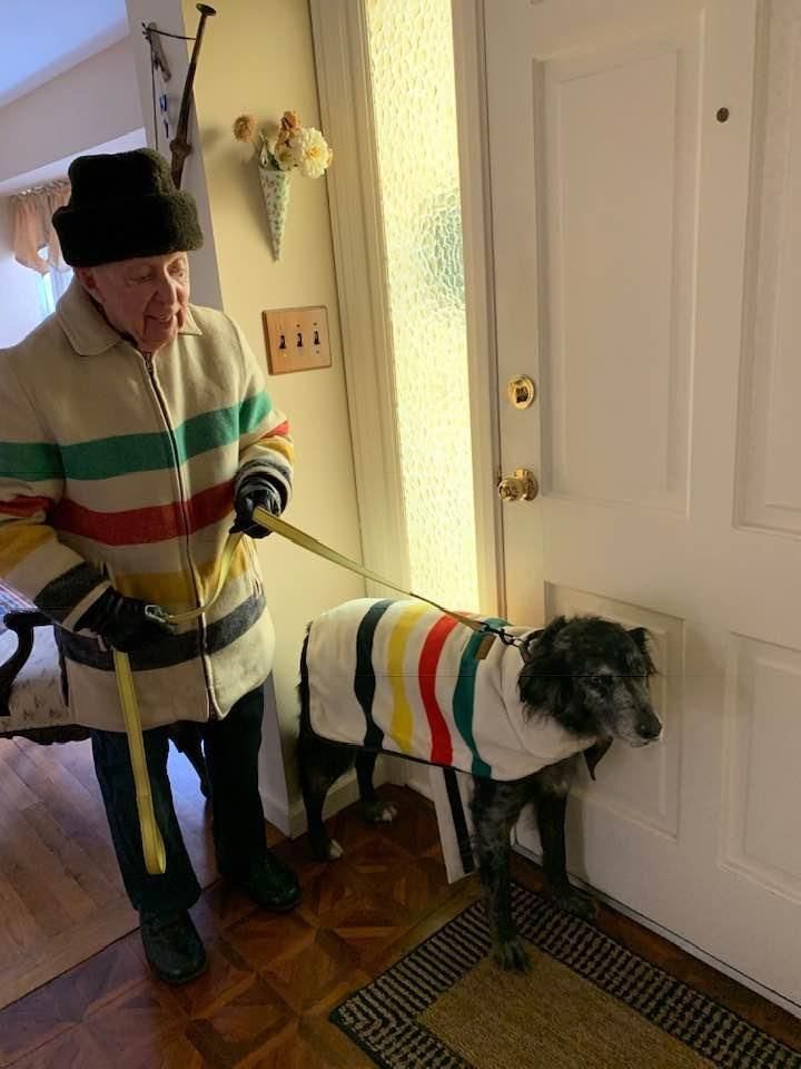 Grandpa with a coat that matches the dog's