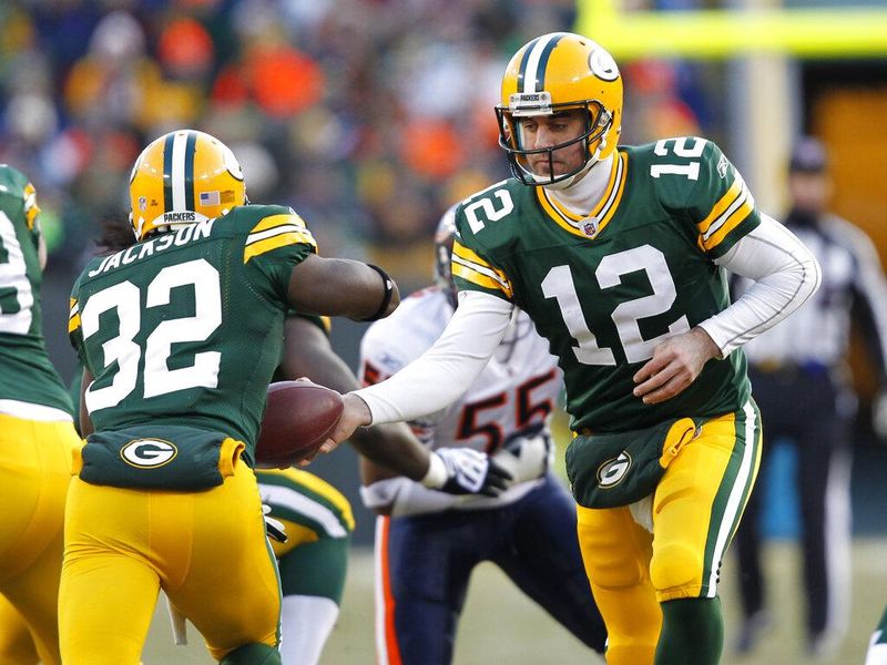 Green Bay Packers' Aaron Rodgers hands off to Brandon Jackson