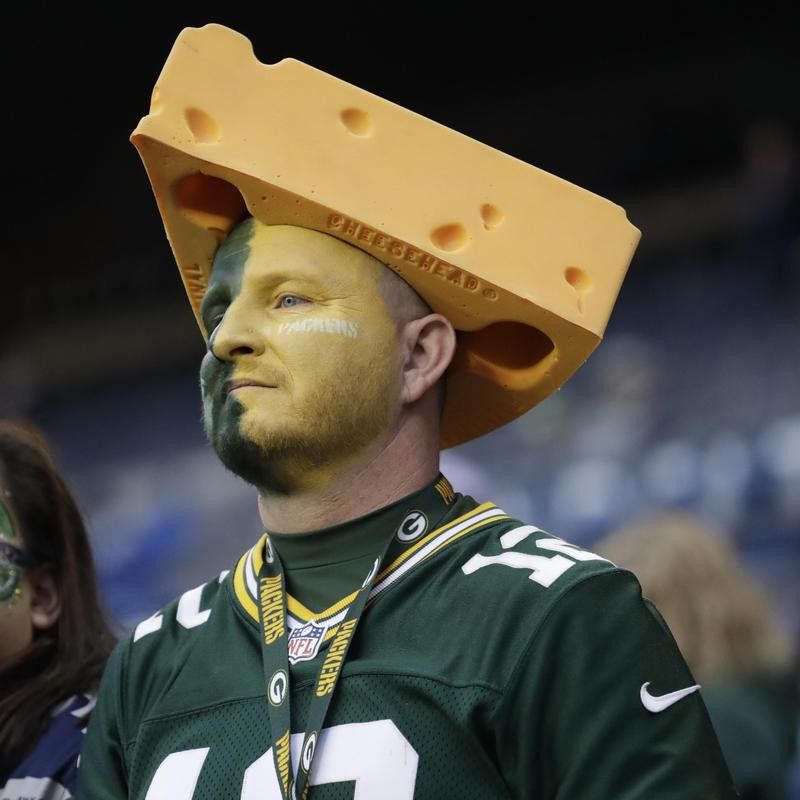 Green Bay Packers fan wearing a cheesehead hat