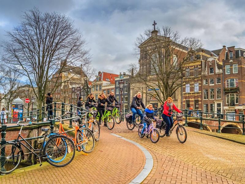 Group of cyclists in the historic center of Amsterdam