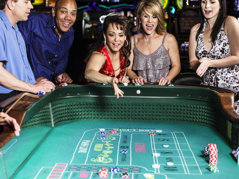 Group of people playing craps in casino