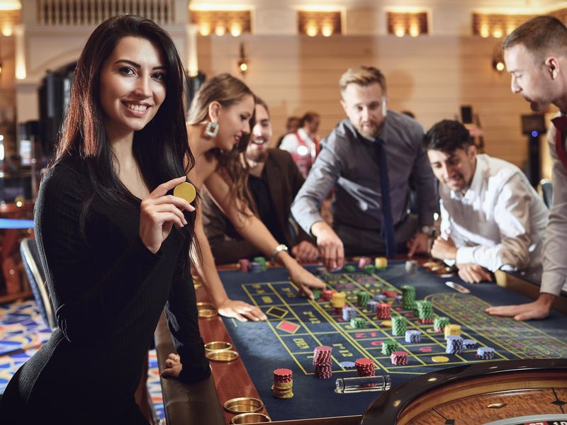 Happy players at the roulette table in a casino