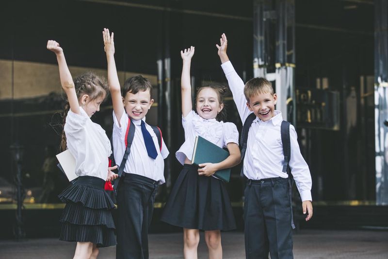 Happy school children in a uniform