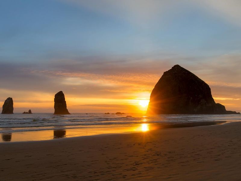 Haystack Rock and the Needles at Cannon Beach on the Oregon Coast USA Sunset