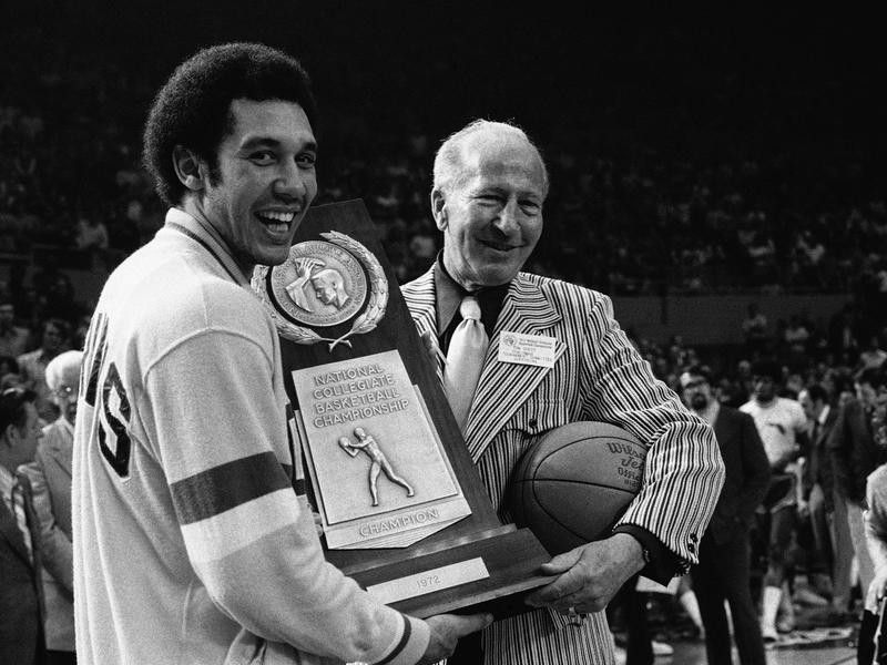 Henry Bibby accepts the NCAA championship trophy