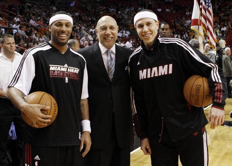 Henry Bibby poses with his son Mike Bibby at Miami Heat game