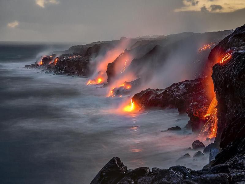 Hot lava entering the ocean in Hawaii Volcanoes National Park