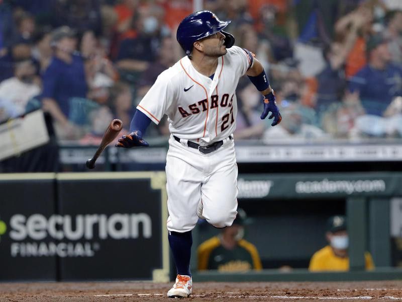 Houston Astros' Jose Altuve flips his bat