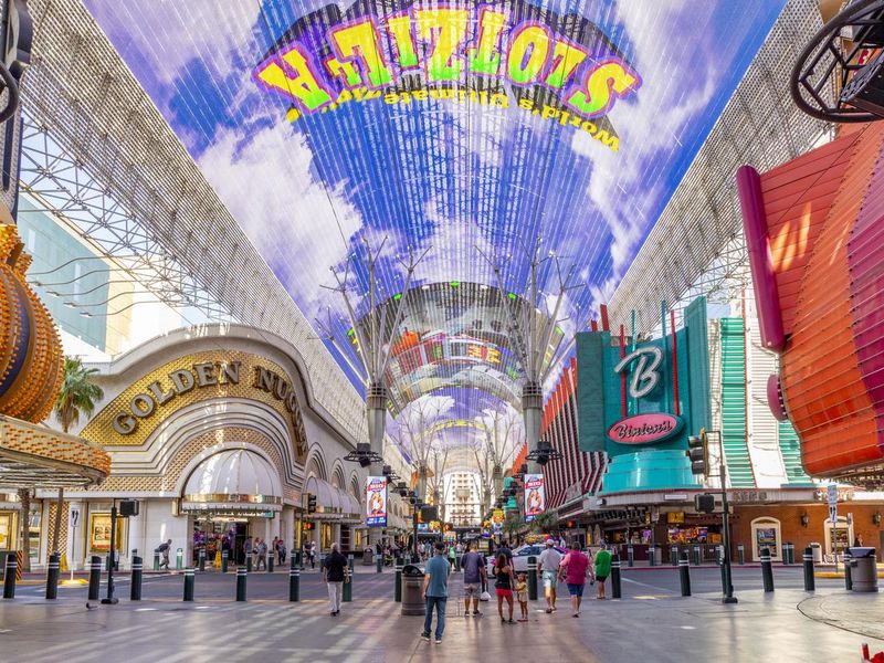 Hustle and bustle of crowds during the day on the famous Fremont Street in the heart of downtown Las Vegas with its Casinos, Neon Lights and Street Entertainment
