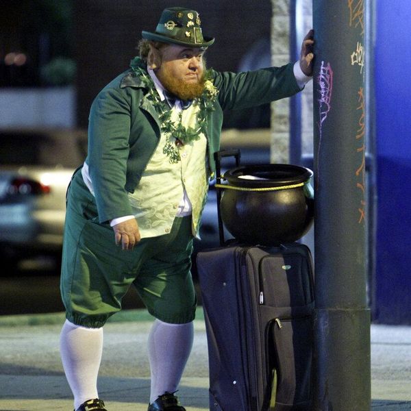 In this photo from Saturday March 5, 2011, an unidentified man dressed as a leprechaun waits for a bus along Frankford Avenue in the Mayfair section of Northeast Philadelphia.  A pub crawl called the Shamrock Shuttle was taking place along several blocks of Frankford Ave. (AP Photo/Joseph Kaczmarek)