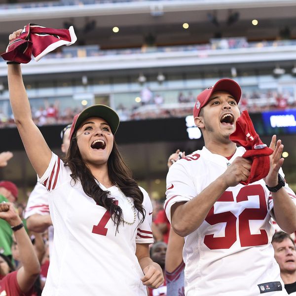 In this Sept. 14, 2014 photo, San Francisco 49ers fans cheer at Levi's Stadium during the first half of an NFL football game against the Chicago Bears in Santa Clara, Calif. If 49ers CEO Jed York realizes his vision, Levi’s Stadium will channel Silicon Valley’s ingenuity to become known as a technology temple programmed to pamper and connect fans who are more accustomed to being corralled in congested venues with little or no Internet access. (AP Photo/Noah Berger)