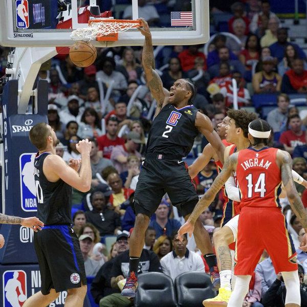 Los Angeles Clippers forward Kawhi Leonard (2) dunks against New Orleans Pelicans center Jaxson Hayes (10) in the second half an NBA basketball game in New Orleans, Saturday, Jan. 18, 2020. (AP Photo/Matthew Hinton)