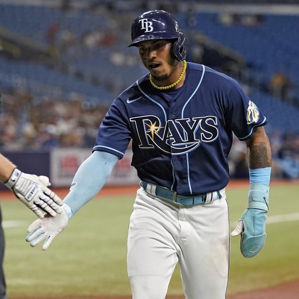 Tampa Bay Rays' Wander Franco celebrates with Taylor Walls (6) after scoring on an RBI single by Isaac Paredes off Toronto Blue Jays starting pitcher Yusei Kikuchi during the first inning of a baseball game Wednesday, May 24, 2023, in St. Petersburg, Fla. (AP Photo/Chris O'Meara)