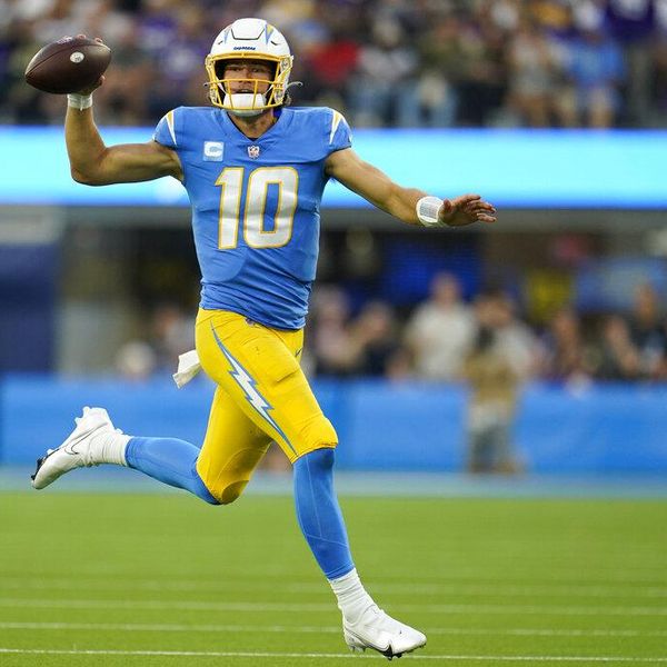 Los Angeles Chargers quarterback Justin Herbert (10) scrambles during the second half of an NFL football game against the Minnesota Vikings Sunday, Nov. 14, 2021, in Inglewood, Calif. (AP Photo/Marcio Jose Sanchez)