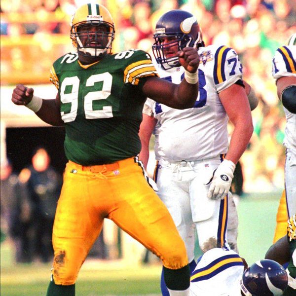 Green Bay Packers' Reggie White (92) celebrates after sacking Minnesota Vikings quarterback Warren Moon during the second quarter Sunday, Oct. 22, 1995, in Green Bay, Wis. Vikings' Todd Steusse stands behind White. (AP Photo/Morry Gash)