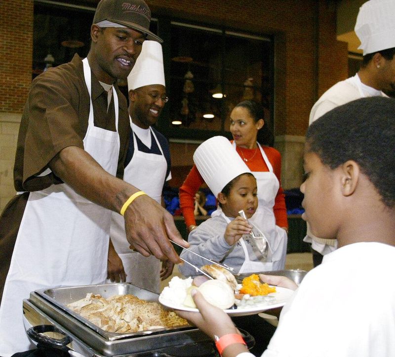Indiana Pacers player Stephen Jackson serves turkey
