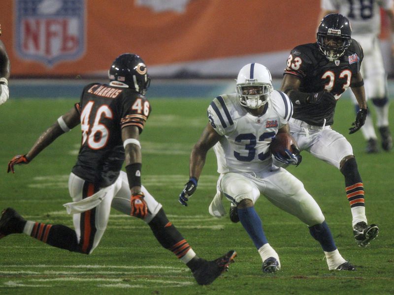 Indianapolis Colts running back Dominic Rhodes is pursued by Chris Harris