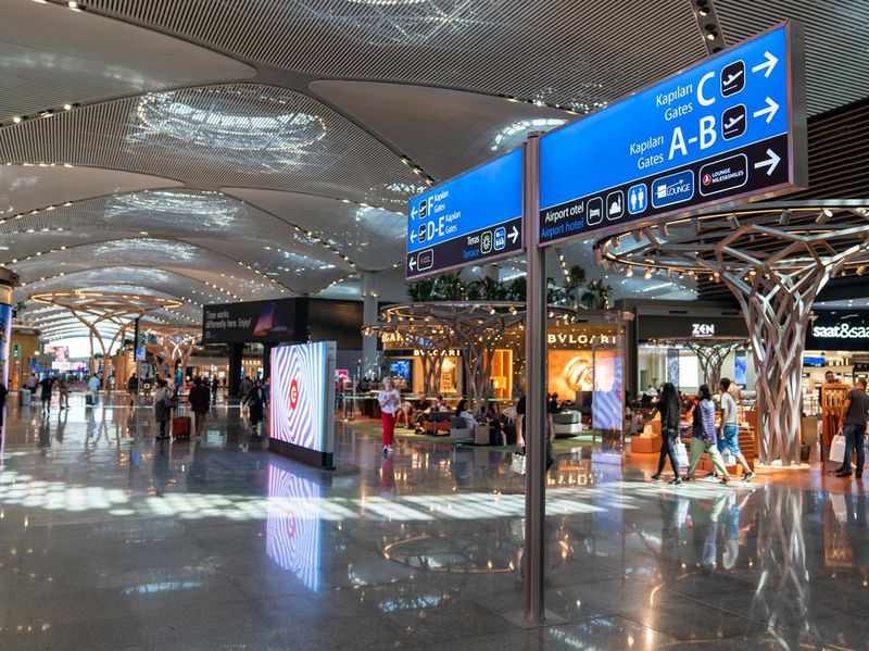 Interior scene with a signage showing the flight gates in New Istanbul Airport