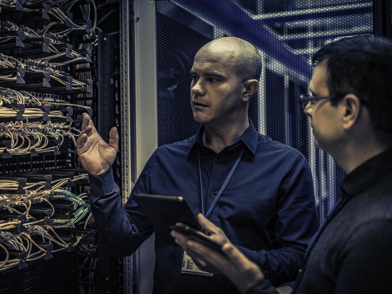 IT engineer explaining server configuration