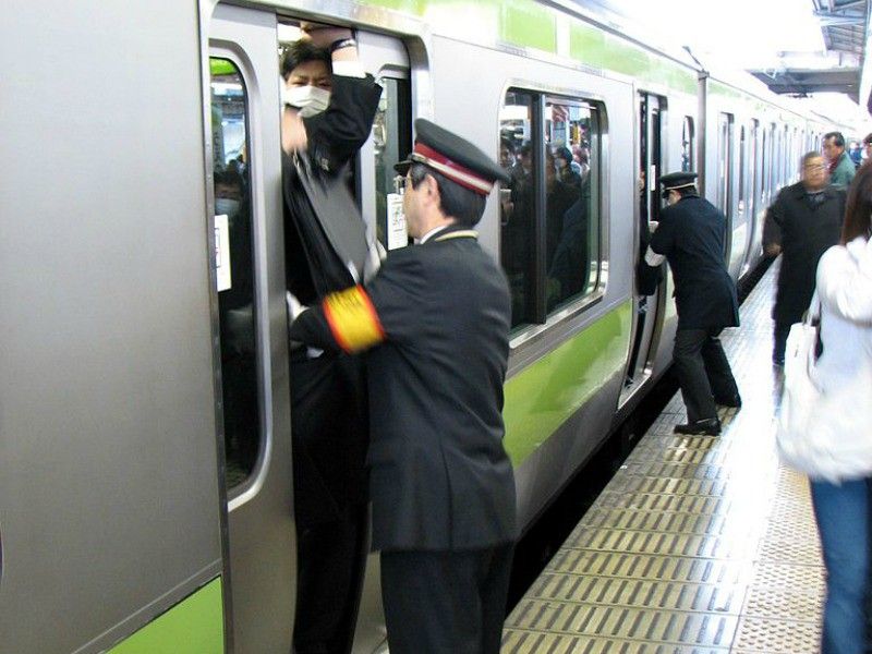 Japanese subway pusher