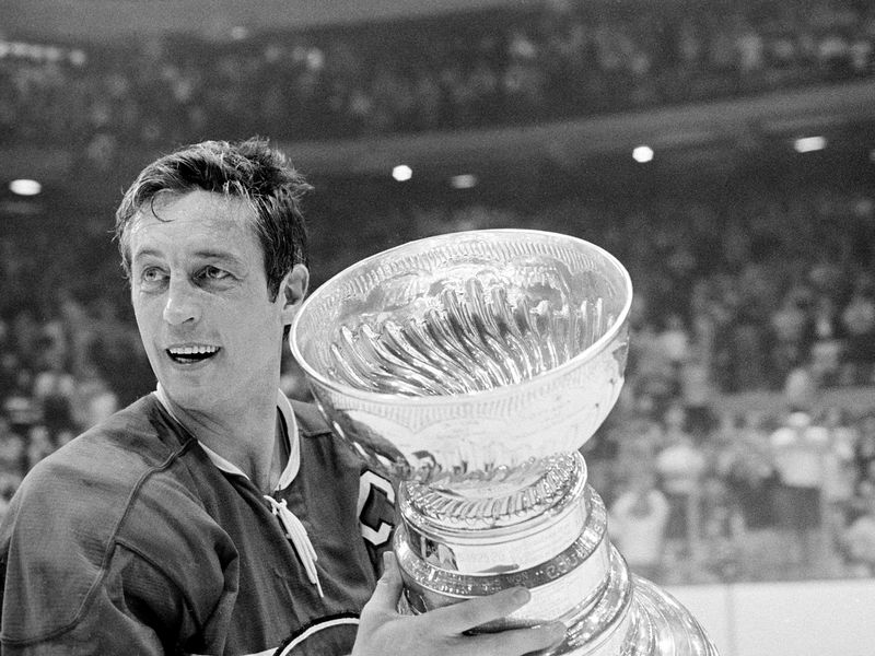 Jean Beliveau holds Stanley Cup trophy