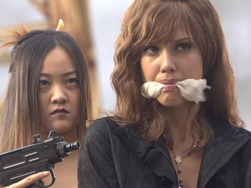 Jessica Alba and Cheryl Chin in Machete (2010)