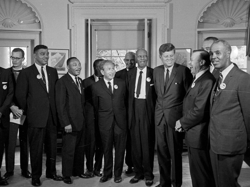 John F. Kennedy with Martin Luther King Jr. and other Black civil rights leaders in 1963