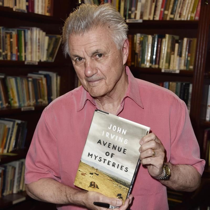 John Irving poses with book "Avenue of Mysteries"