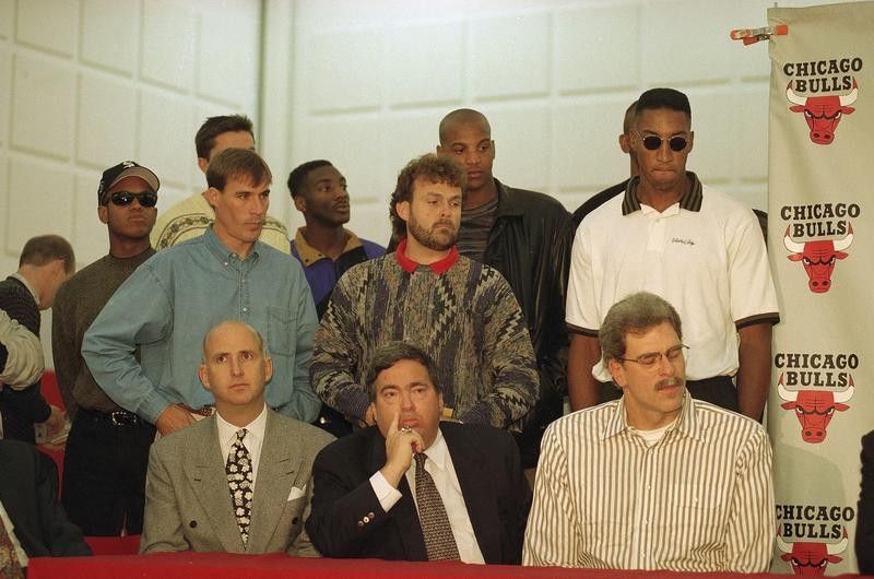 John Paxson watches with members of Chicago Bulls as Michael Jordan retires