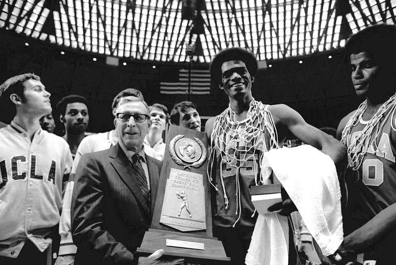 John Wooden holds championship trophy with Bruins