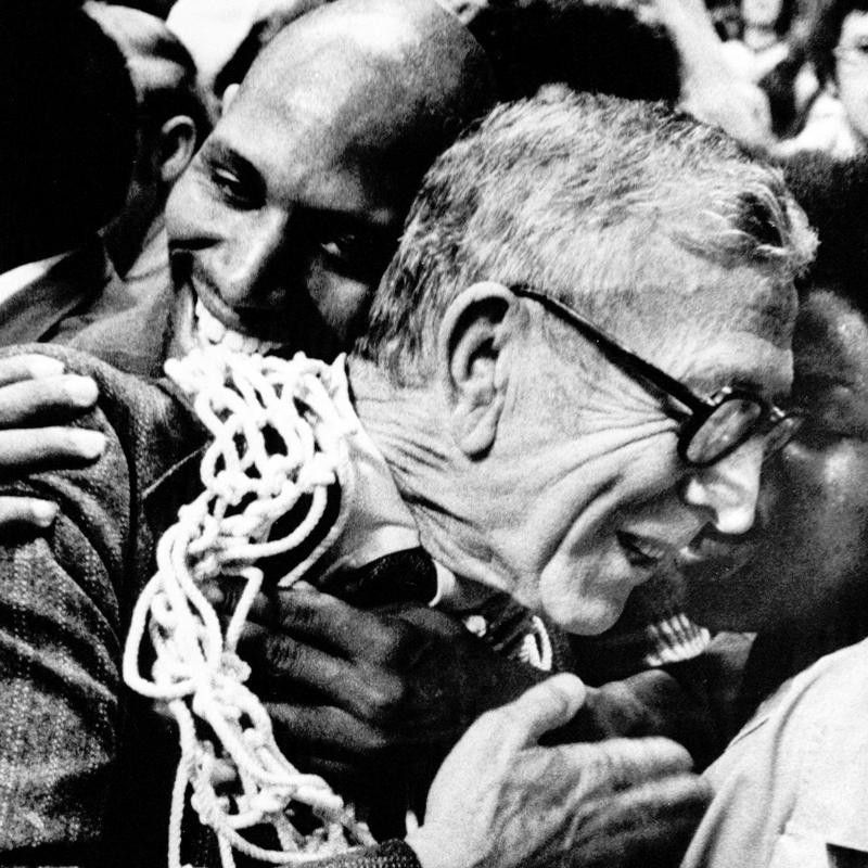John Wooden wears basketball net around neck