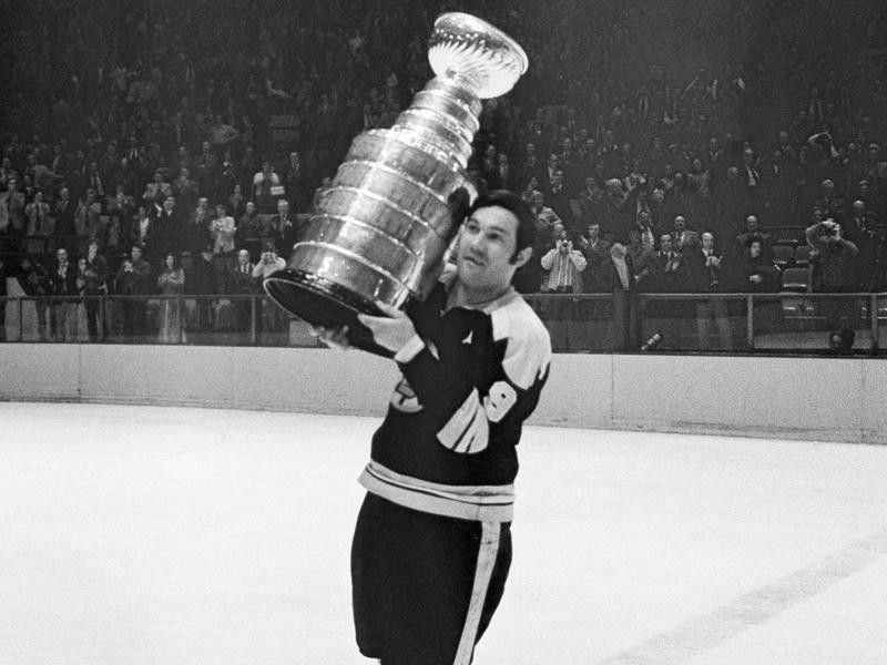 Johnny Bucyk lifts the Stanley Cup