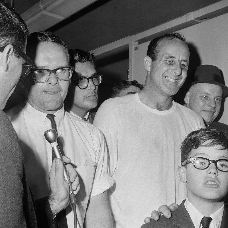 Kansas City Chiefs owner Lamar Hunt visits the Green Bay Packers' dressing room and congratulates Max McGee