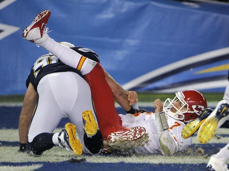 Kansas City Chiefs quarterback Matt Cassel loses ball while being sacked by San Diego Chargers Jarret Johnson
