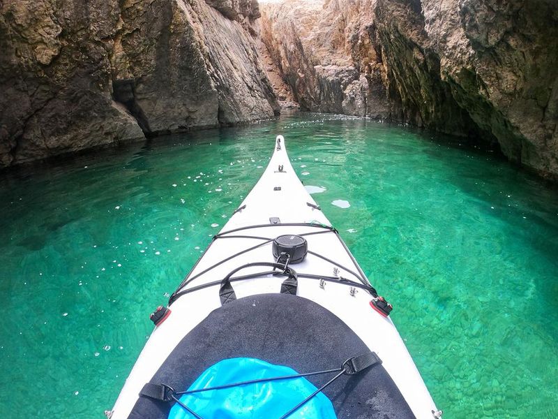 Kayaking in narrow canyon