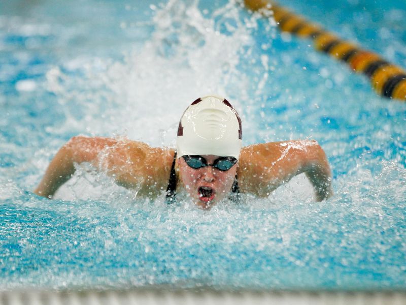 Ketchikan High School swimmer Janelle Stacey in butterfly race at Alaska state swimming championships