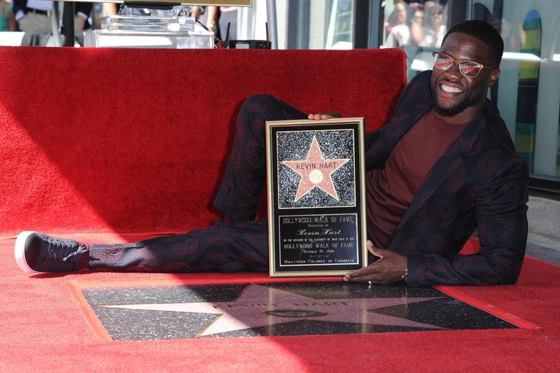 Kevin Hart poses with star on Hollywood Walk of Fame
