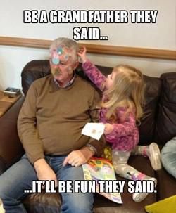 Kid decorating her grandpa with stickers