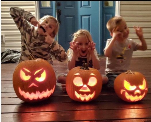 Kids with cute pumpkin carvings
