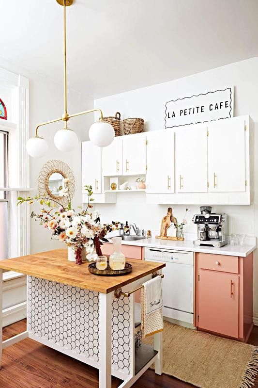 Kitchen with a honeycomb-style backsplash and pink cabinets